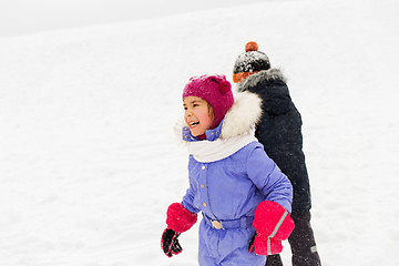 Image showing happy little kids playing outdoors in winter