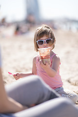 Image showing Mom and daughter on the beach