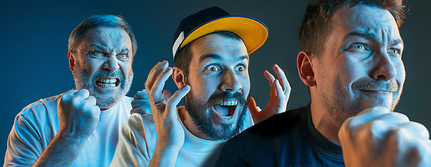 Image showing The emotional angry men screaming on blue studio background