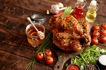 Image showing Roasted whole chicken or turkey served with chilli pepers and chive