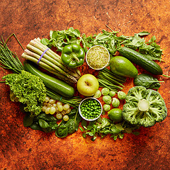 Image showing Fresh green vegetables and fruits assortment placed on a rusty metal