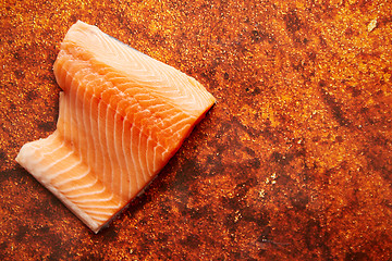 Image showing Raw fresh salmon meat placed on rusty metal background