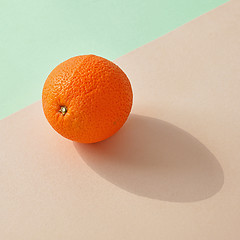 Image showing fresh orange on colorful background