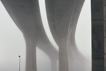 Image showing Pillars of the highway bridge in fog