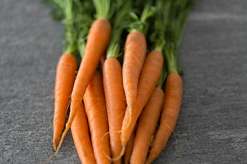 Image showing close up of carrot bunch on table