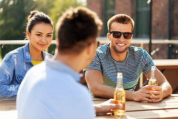 Image showing happy friends with drinks at rooftop party