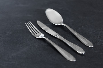 Image showing close up of fork, knife and spoon on table