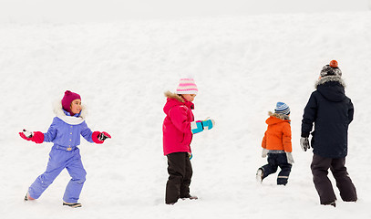 Image showing happy little kids playing outdoors in winter