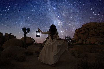 Image showing Girl Holding Lantern in the Desert Under the Milky Way