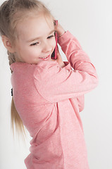 Image showing Little girl talking on mobile 