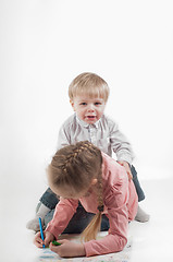 Image showing Little girl and boy painting