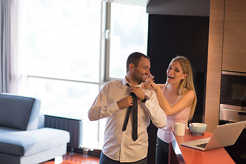 Image showing A young couple is preparing for a job and using a laptop