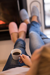 Image showing Young couple  in front of fireplace