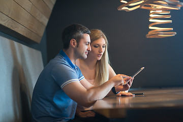 Image showing couple using tablet at home