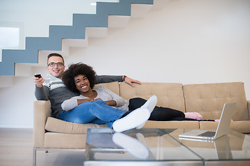 Image showing multiethnic couple relaxing at home