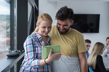 Image showing Business People Working With Tablet in startup office