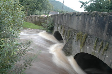 Image showing flood under old bridge