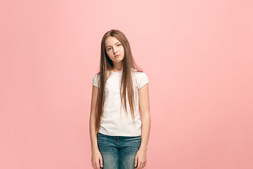 Image showing Young serious thoughtful teen girl. Doubt concept.