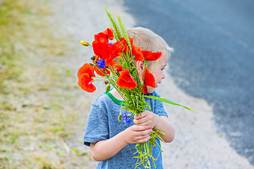 Image showing Cute boy inear road