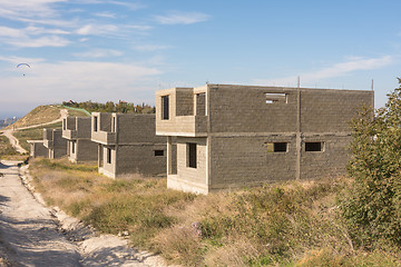 Image showing Abandoned construction of a cottage settlement