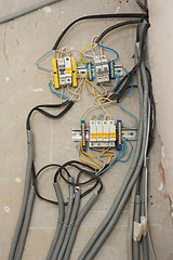 Image showing Homemade electricity wiring on the ceiling of the apartment