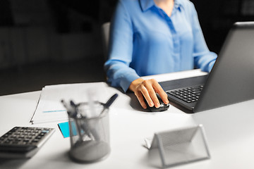 Image showing close up of businesswoman using computer mouse