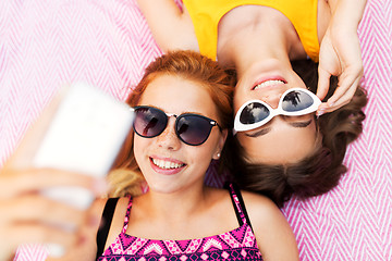 Image showing teenage girls in sunglasses taking selfie