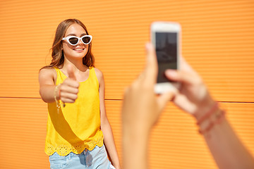 Image showing teenage girl photographing friend by smartphone