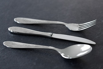 Image showing close up of fork, knife and spoon on table