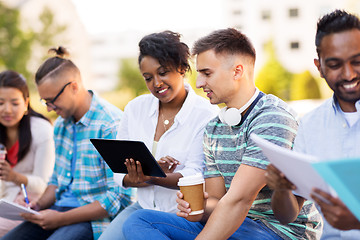 Image showing happy students with tablet pc and coffee outdoors