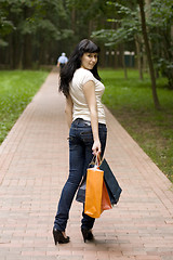 Image showing brunet girl with shopping bags