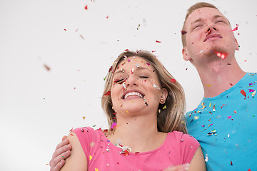 Image showing romantic young  couple celebrating  party with confetti