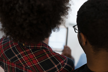 Image showing african american couple using tablet at home