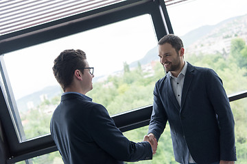 Image showing cloasing the deal in modern office interior