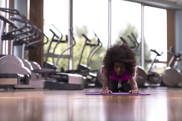 Image showing african american woman exercise yoga in gym