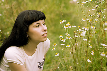 Image showing girl relaxing on a meadow