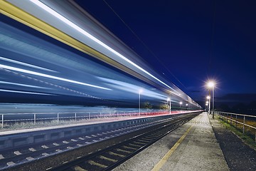 Image showing Light trails of passenger train