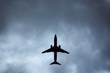 Image showing Silhouette of airplane in storm