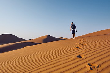 Image showing Tourist in desert