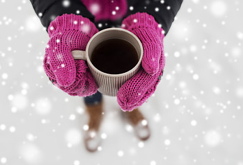 Image showing close up of woman with tea mug outdoors in winter