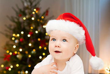 Image showing close up of little baby in santa hat at christmas