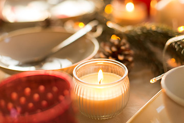 Image showing candle burning on christmas table