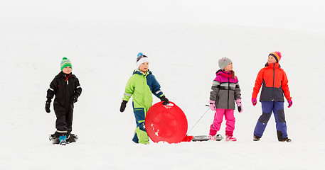 Image showing happy little kids with sleds in winter