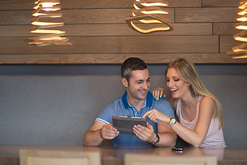 Image showing couple using tablet at home