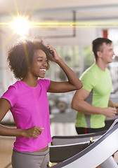 Image showing people exercisinng a cardio on treadmill