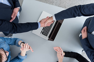 Image showing cloasing the deal in modern office interior top view