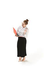 Image showing Full length portrait of a smiling female teacher holding a laptop isolated against white background