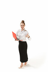 Image showing Full length portrait of a smiling female teacher holding a laptop isolated against white background