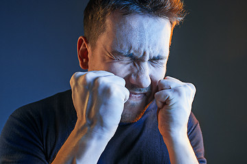 Image showing Sports, emotions and fan people concept - sad man watching sports on tv and supporting team at home