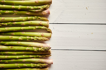 Image showing Above view of flat-lay organic raw uncooked green asparagus